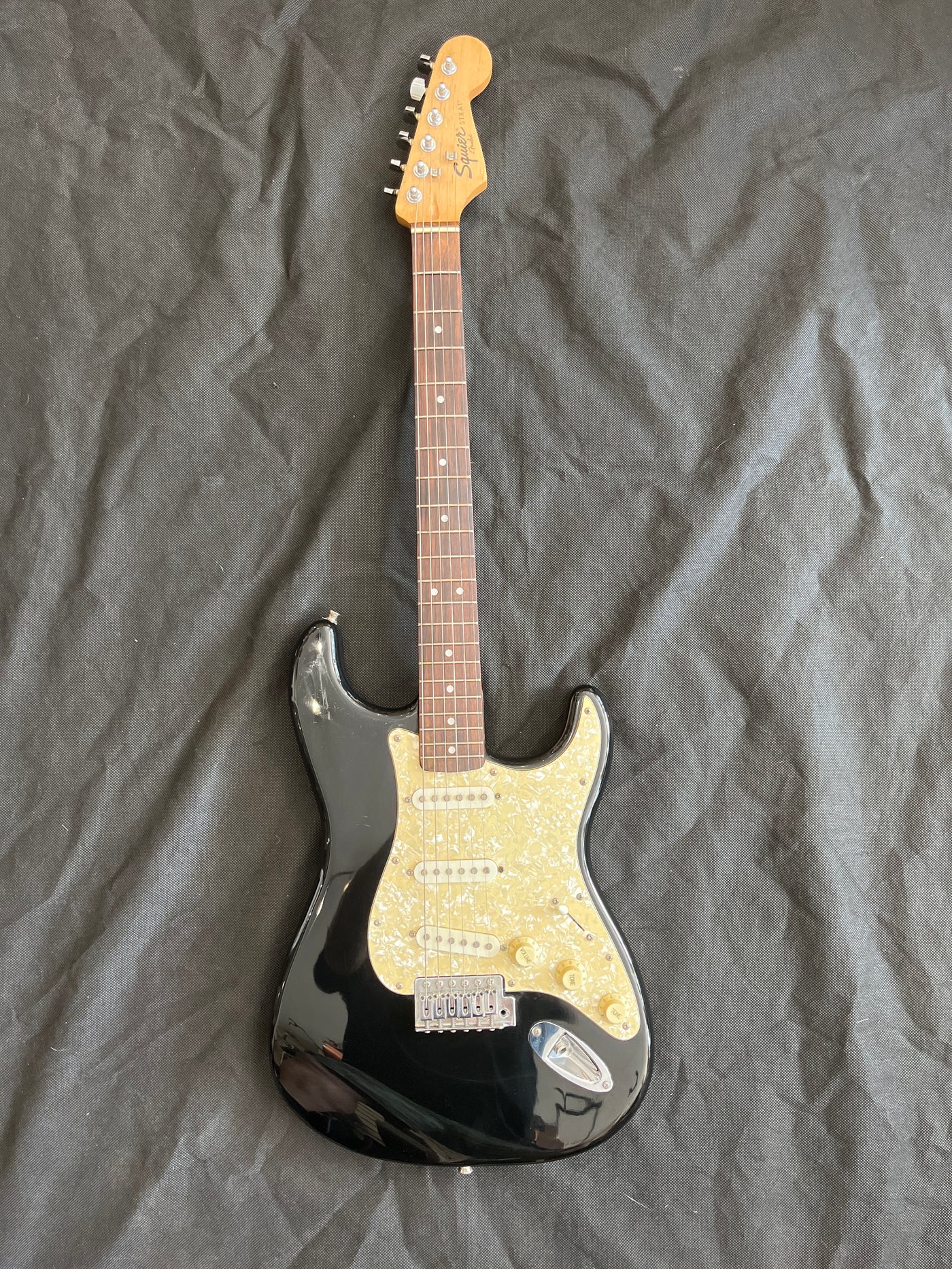 Early Squier stratocaster, Pearloid scratchplate, Black, Used - FF59E