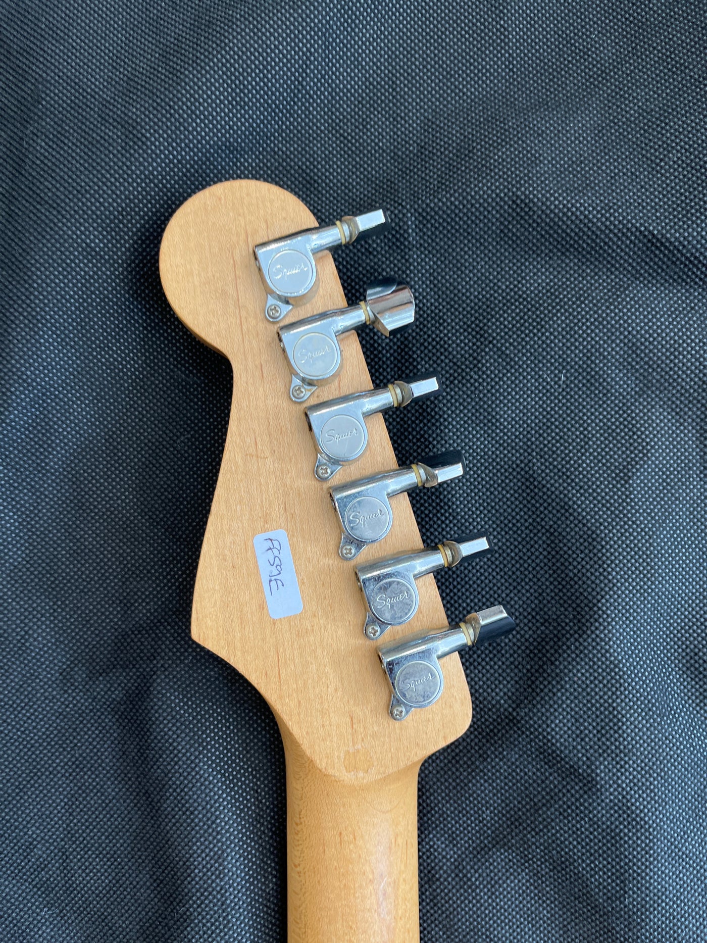 Early Squier stratocaster, Pearloid scratchplate, Black, Used - FF59E
